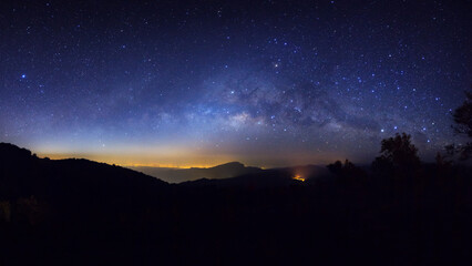 Wall Mural - panorama silhouette tree on high mountain with milky way galaxy, night starry sky with stars
