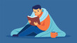 © Justlight - A man snuggled up under a weighted blanket indulging in a good book and a cup of hot cocoa..