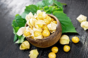 Poster - Physalis in bowl on dark wooden board