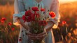 Graceful hands of a woman hold a bouquet of red poppy flowers, symbolizing both remembrance and hope for a peaceful future.