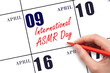 April 9. Hand writing text International ASMR Day on calendar date. Save the date.