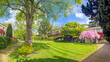 Panorama of the Priory park in the spring season with fresh trees and green grass among the traditional English houses in London