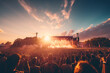© CozyDigital - Open air concert. Stage and a large number of people having a good time at rave party or concert. Photo at sunset