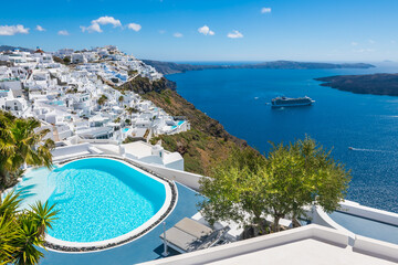 Wall Mural - White architecture in Santorini island, Greece. Luxury swimming pool with sea view