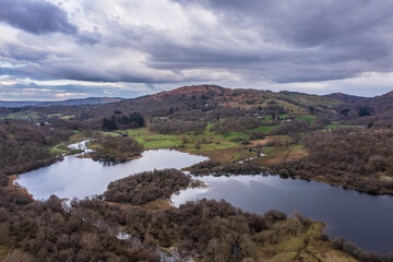 Naklejka na meble Stunning aerial drone landscape image over River Brathay near Elterwater in Lake District with Langdale Pikes in distance