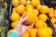Orange fruit in hand