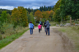 Fototapeta  - A group of tourists on a trail near Szklarska Poręba
