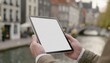 © Eggy - Tablet held by Man in Outside in the City - Mockup for Application or Web Design - Template for Presentation of Graphic Design - Corporate Representation at Consumers