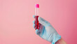 Laboratory worker's hand in rubber glove holding test tube with blood sample on light background