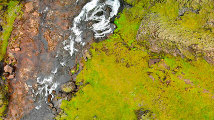 Sticker - Aerial view of beautiful Stjornarfoss waterfall on a wet rainy day