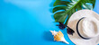 horizontal summer background with place for text. Top view of summer accessories: straw hat, sunglasses, seashells and tropical monstera leaf. Generative AI
