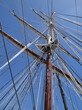 Blue sky and the main-mast of the sailing vessel