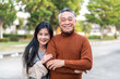 © Art_Photo - Portrait of enjoy happy love asian family senior mature father and young daughter smiling play laughing and having fun together at home, care, elderly, insurance.happy family and Father Day concept