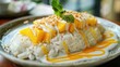 delectable serving of sticky rice with sweet mango slices, drizzled with coconut cream, showcasing the beloved Thai dessert's deliciousness.