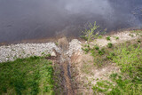 Fototapeta  - The mouth of a small stream into the Warta River