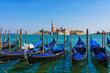 View of the gondolas of the Grand Canal on a sunny day in Venice, Italy. San Giorgio Maggiore.