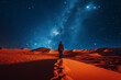 person seen from behind in a sandy desert at night where the milky way and stars are visible