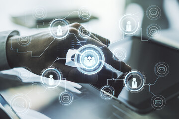Poster - Double exposure of social network icons concept and hand working with a digital tablet on background. Networking concept