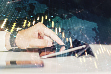 Poster - Double exposure of abstract creative financial chart with world map and with finger clicks on a digital tablet on background, research and strategy concept