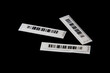 © sebi_2569 - Labels with anti-theft barcodes on a black background