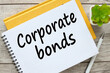 Corporate bonds. Business and finance concept. notepad with text on a yellow notebook.