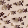 3d rendered photos of roasted coffee beans on pastel background with French vanilla flowers made with generative AI