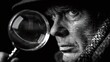 © Екатерина Чумаченко - man investigator detective in hat looks through a magnifying glass on a black isolated background