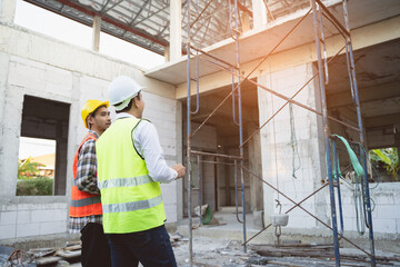 Wall Mural - Client and Contractor discussing plan to renovation house.