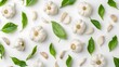 © BrilliantPixels - garlic with leaves creative pattern isolated on white background. Top view and flat lay.