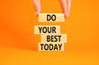 Do your best today symbol. Concept words Do your best today on beautiful wooden block. Beautiful orange table background. Businessman hand. Business motivational do your best today concept. Copy space