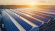 © amonrat - Aerial view of solar panels on factory roof. Blue shiny solar photo voltaic panels system product