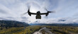 Military Aircraft flying over the Mountain Landscape. 3d Rendering. Background from BC, Canada