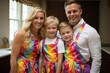 © Adobe Contributor - Happy family of four wearing colorful aprons in the kitchen