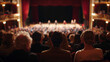© Frank Gärtner - Over-the-shoulder view of a theater audience watching a stage performance, capturing the atmosphere