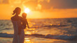 Woman Holding Baby on Beach at Sunset