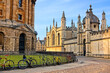 © Jenifoto - Oxford University at dusk, England, UK. Radcliffe Camera and All Souls College with bicycles on cobblestone streets.