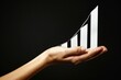 Close-up of a Hand Holding a Rising Bar Chart - Growth, Success, Financial Analysis
