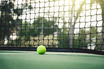 Wall Mural - Tennis ball on tennis court with net in background