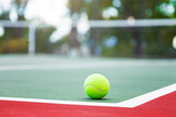 Fototapeta Zachód słońca - Tennis ball on the court with copy space for your text