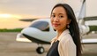 © Marko - Young, successful woman stands outside waiting to board a flight on a private jet