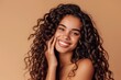 © LukaszDesign - Hair care, grin, and studio portrait of woman with salon curl keratin treatment. Makeup, cosmetics, and headshot of Indian female model with long, lustrous, clean hair on brown background.