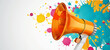 A colorful megaphone on a white background with splashes of paint