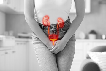 Poster - Woman suffering from cystitis at home, closeup. Illustration of urinary system