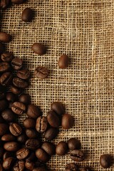 Wall Mural - coffee beans on a burlap background. selective focus