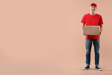 Wall Mural - Happy courier with parcel on beige background. Space for text