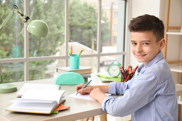 Canvas Print - Little boy doing lessons at home