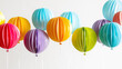 Colorful 3D paper balloons in a range of hues, floating with a sense of lightness and celebration.