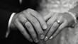 A wedding photo showing two hands with rings