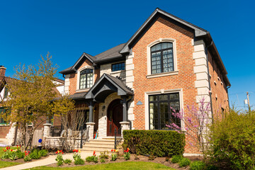 neighborhood house architecture. modern cottage house. property in neighborhood. residential building house outdoor. vintage cottage style home in residential neighborhood. suburban home