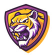 close-up of a Bengal tiger's head with a menacing snarl. The tiger is framed by a purple shield with LSU written in gold lettering